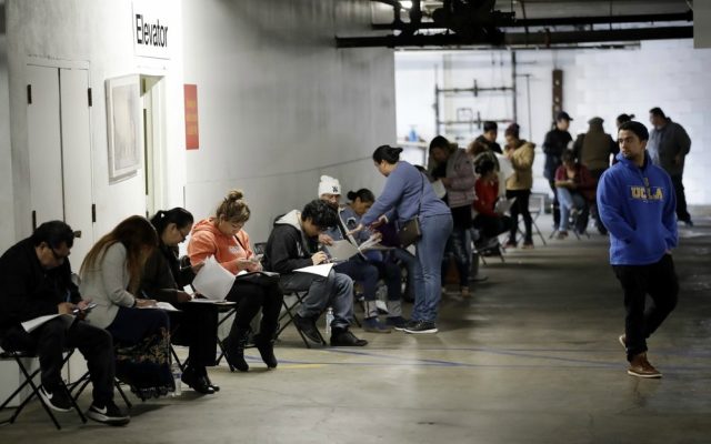A record 6.6 million seek US jobless aid as layoffs mount